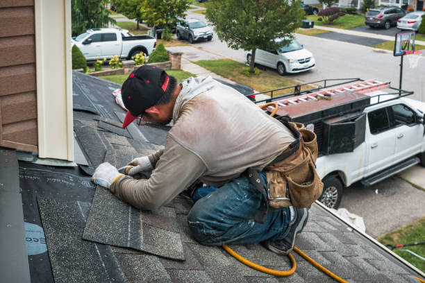 Professional Gutter Installation technician working in Maynard, MA